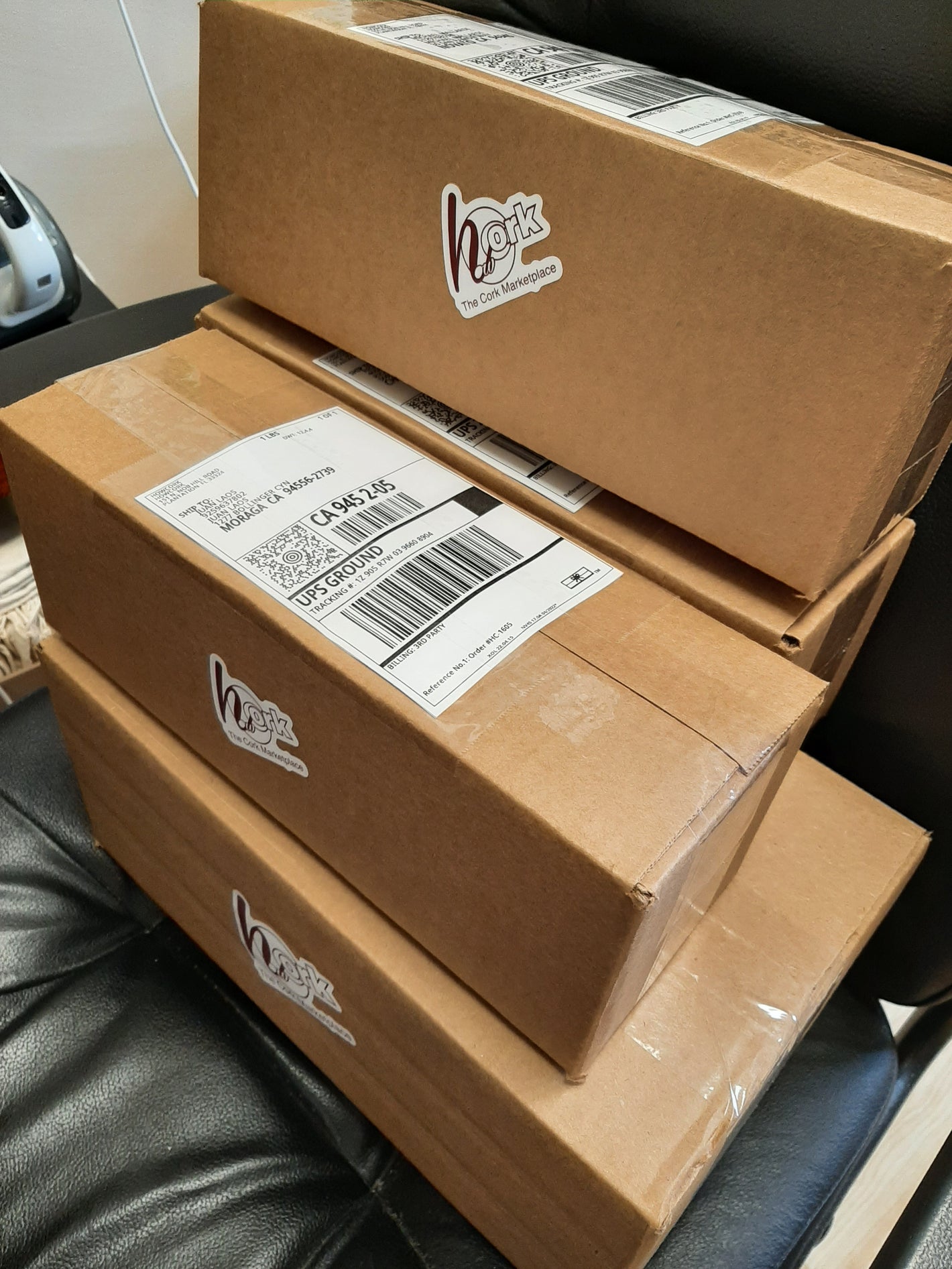 Boxes of customer orders stacked waiting for shipment